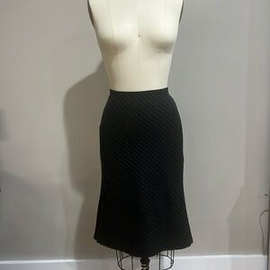 Black skirt with design. Flows in back.